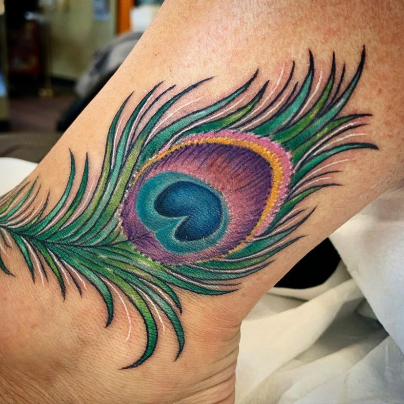 peacock feather cover-up tattoo after 1